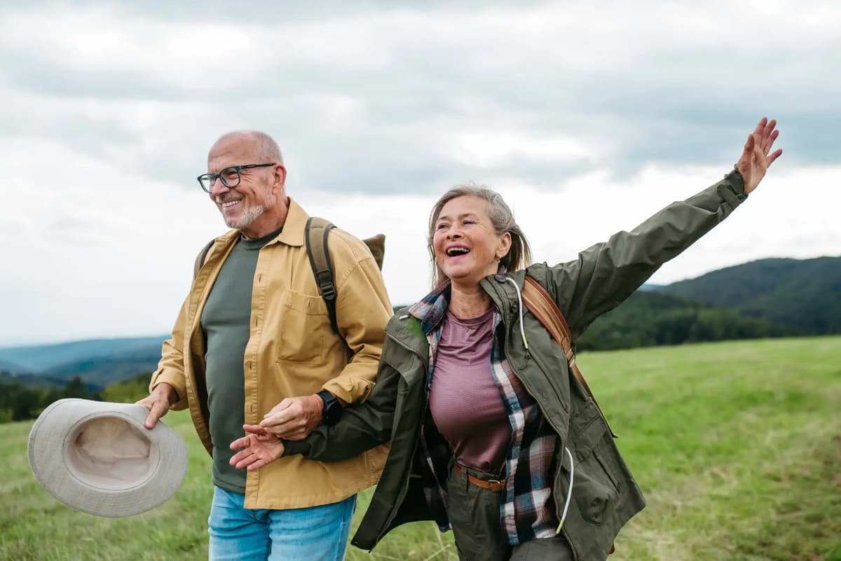 Older couple looking happy and optimistic about their healthcare